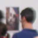people in gallery, the guy in blue is looking at my works.